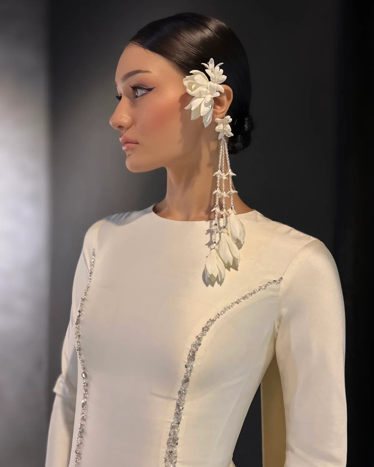 Elegant updo with floral accessory